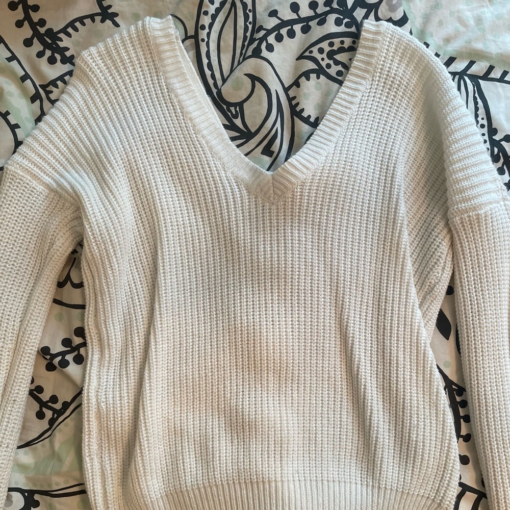 White/Offwhite knitted sweater with lace up tie in the back